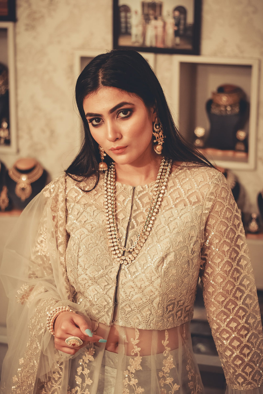 Woman in elegant gold Indian ethnic dress — quiet luxury in Indian fashion 2026