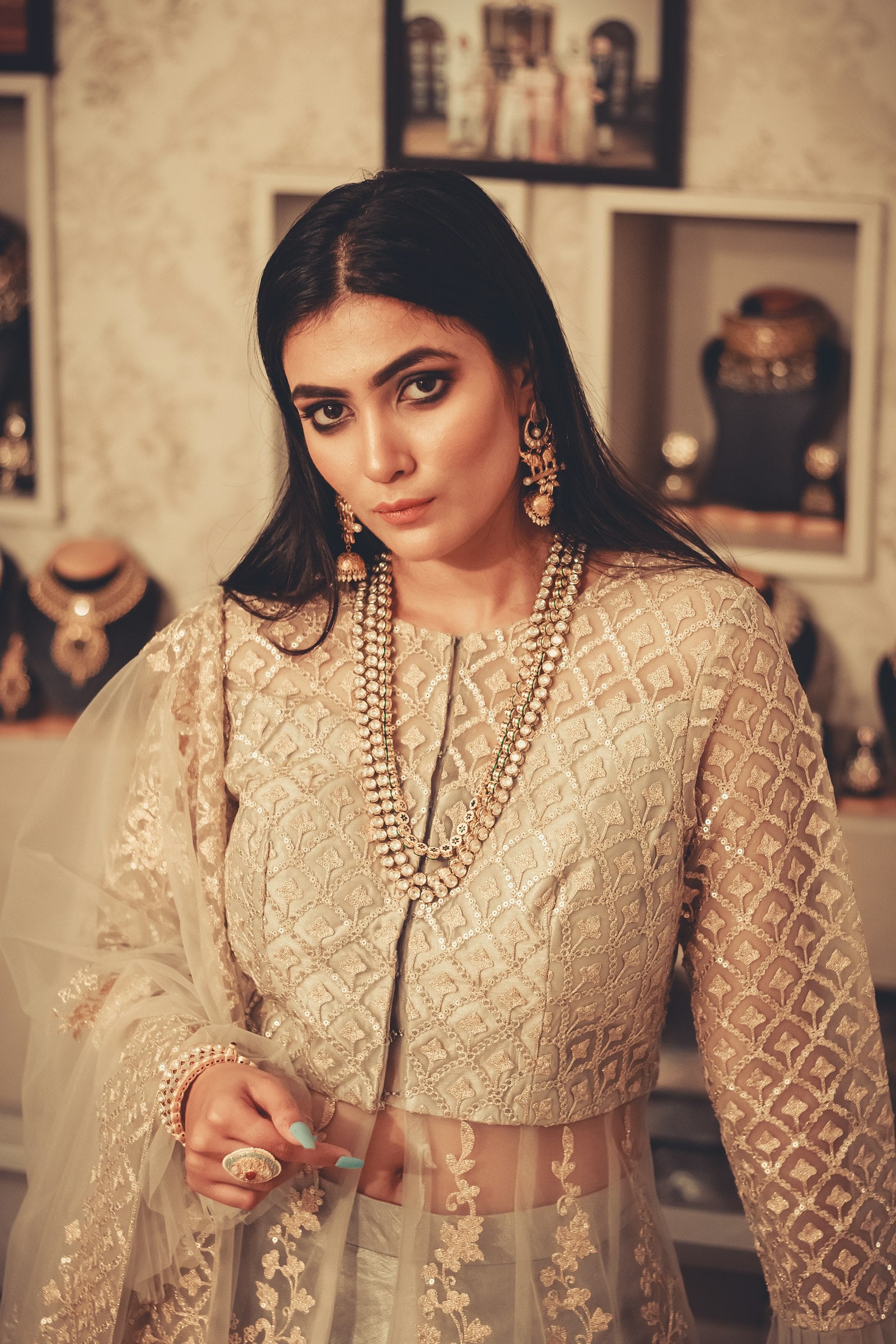 Woman in elegant gold Indian ethnic dress — quiet luxury in Indian fashion 2026
