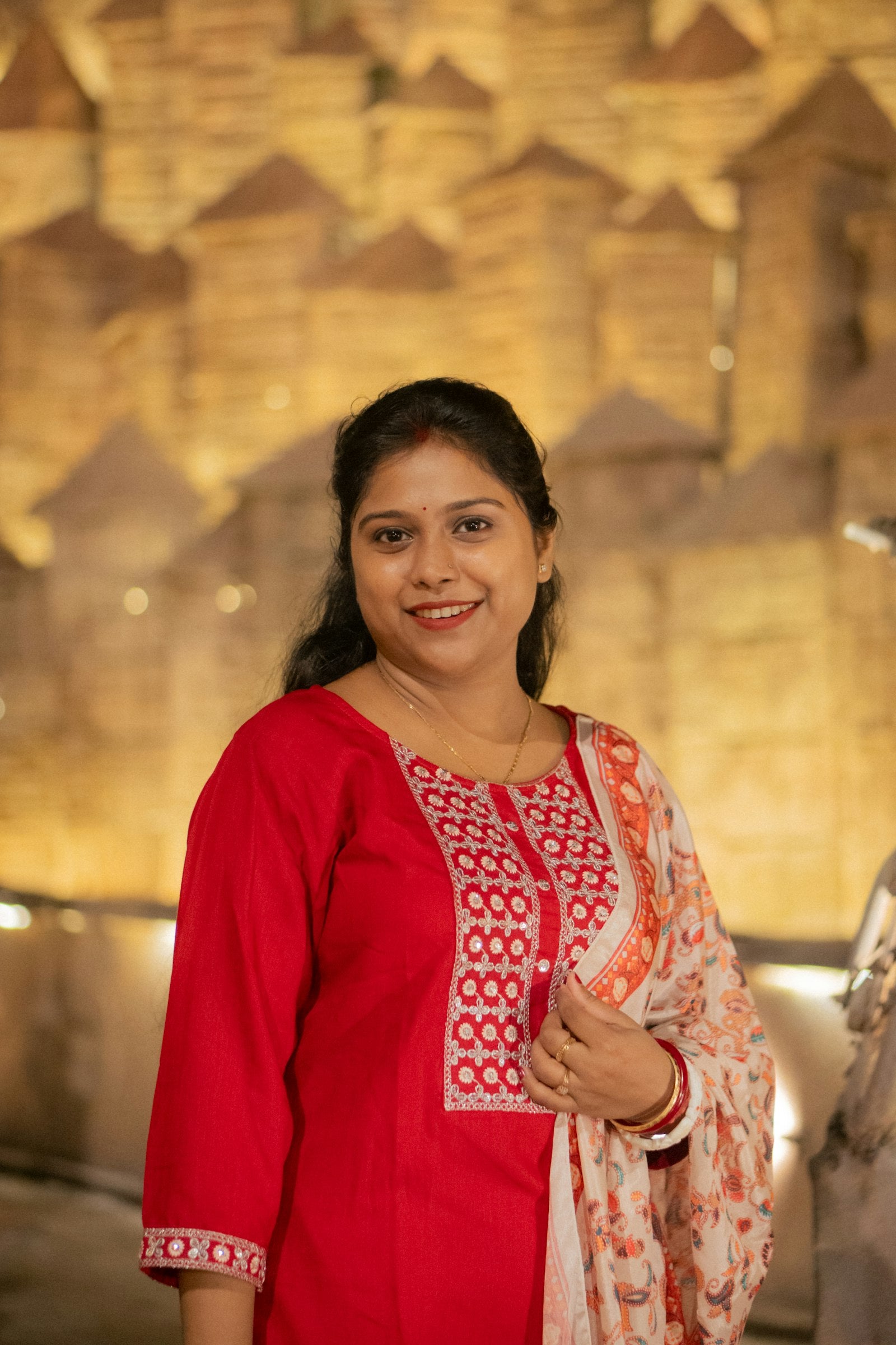 Woman in intricately embroidered Indian ethnic wear — Indian embroidery techniques guide