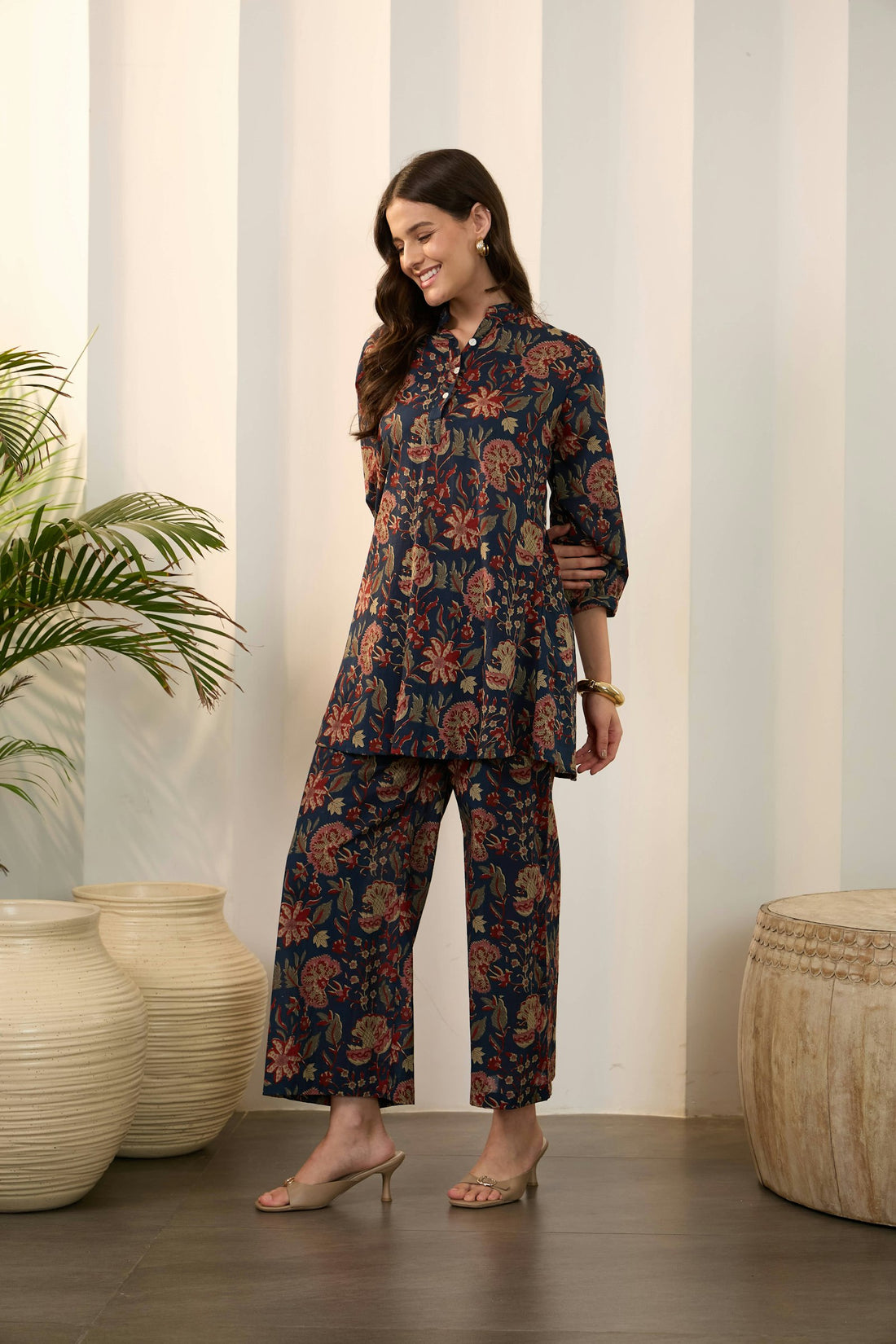 Woman in a floral Indian ethnic ensemble — conscious fashion and the real cost of fast fashion
